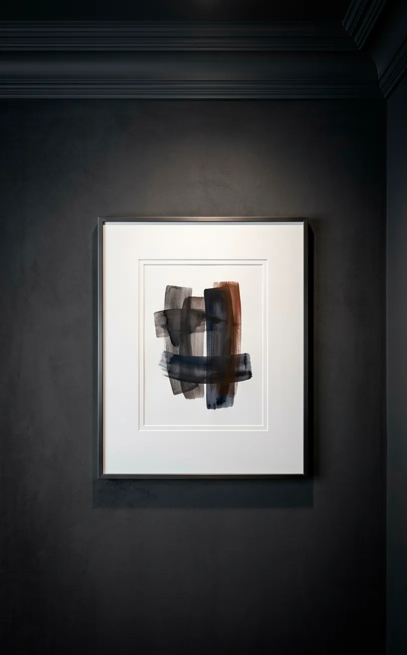 Detail of matte dark paint and crown molding with framed art.