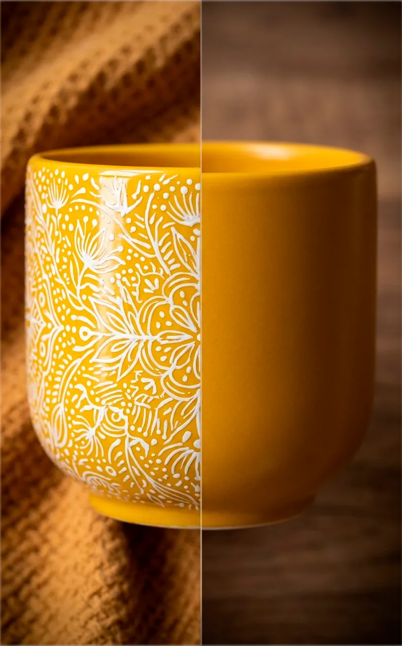 Detail of white floral patterns on a mustard yellow ceramic planter.