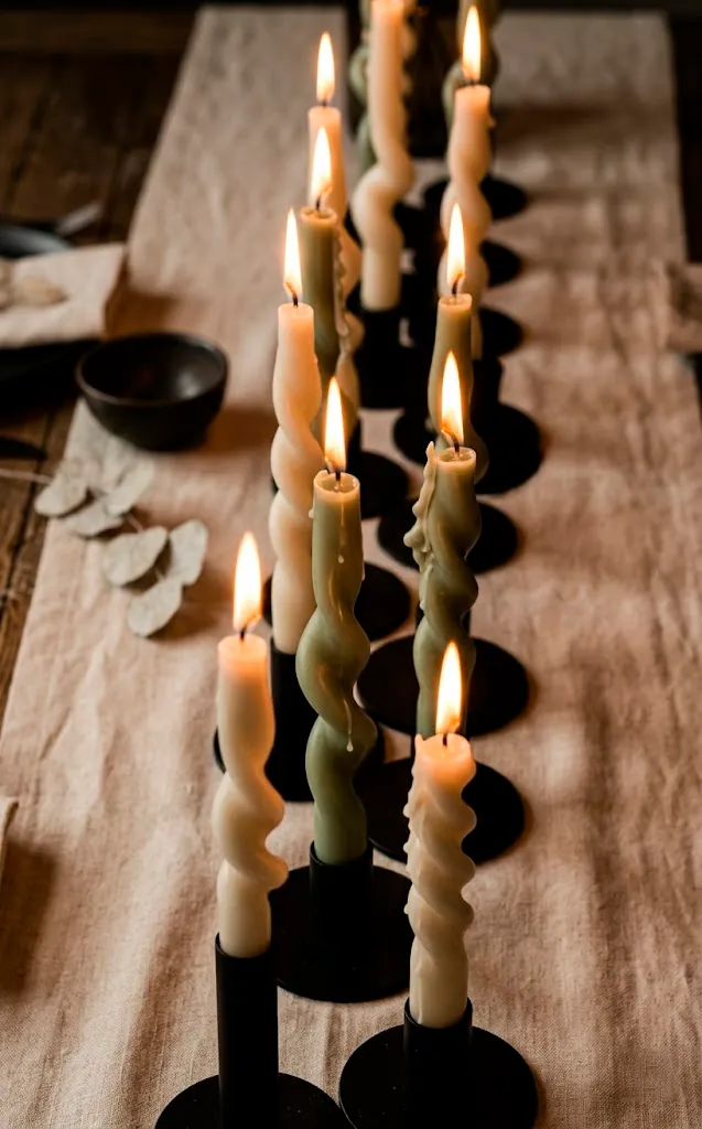 Modern twisted and wiggly taper candles on a minimalist wedding table.