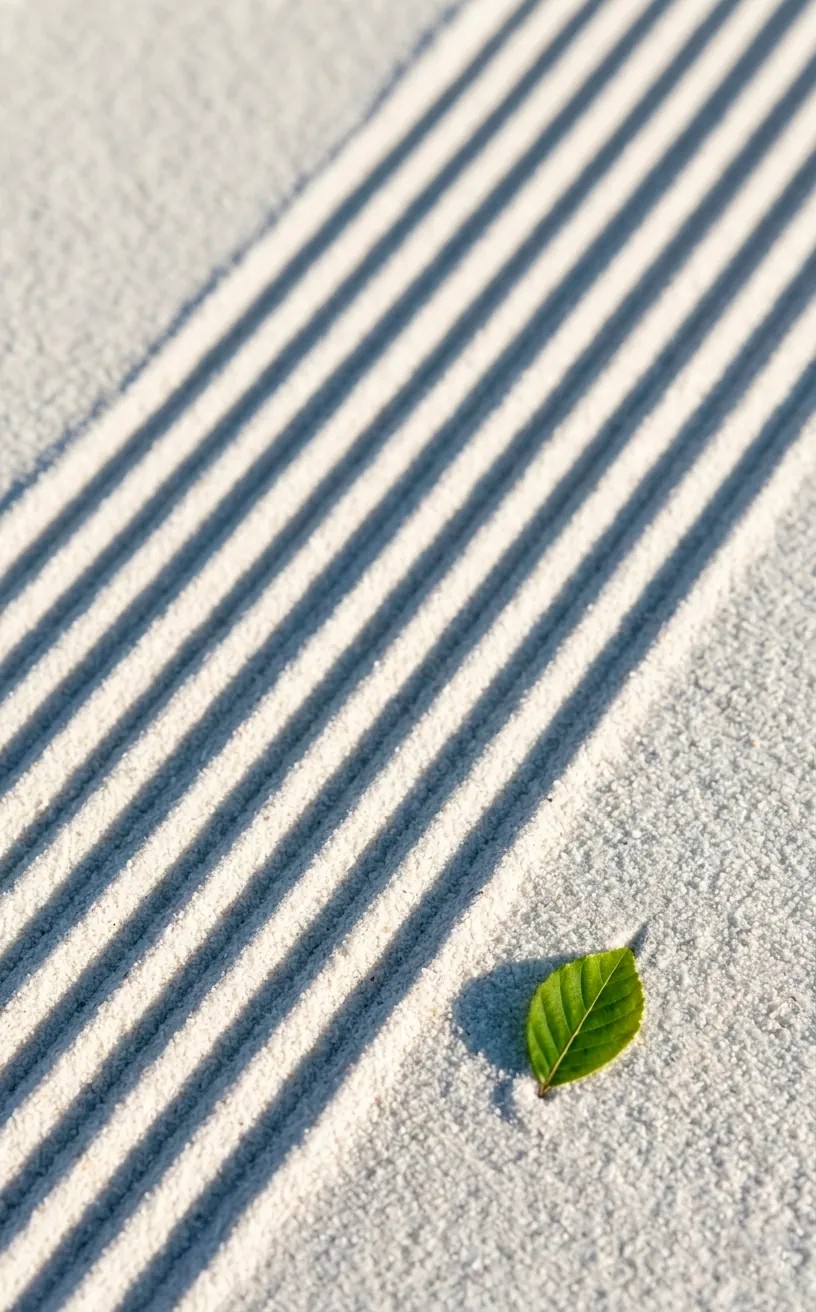 Close-up of raked sand patterns in a Japanese Zen garden.