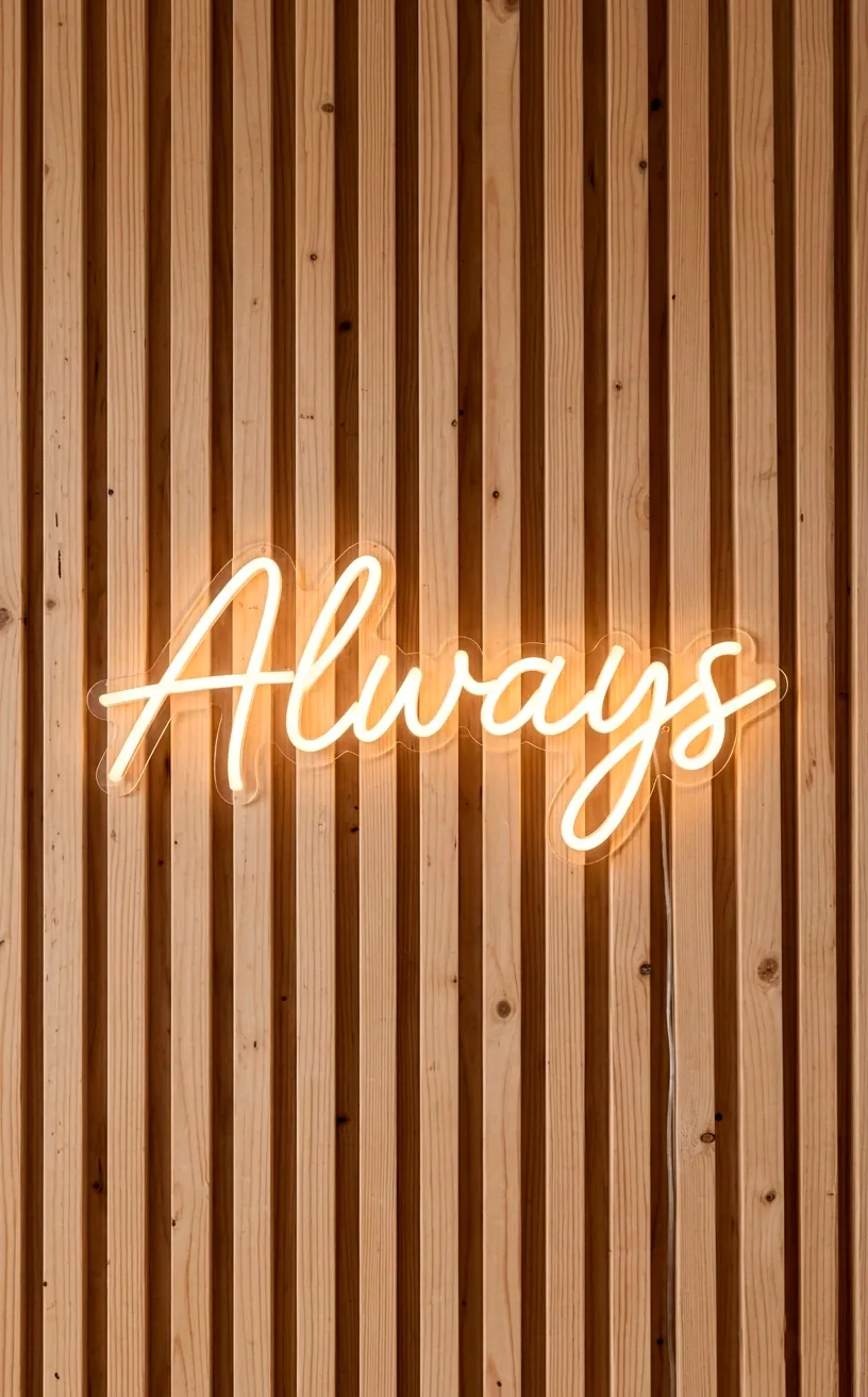 Minimalist neon wedding sign on a modern wood slat wall.