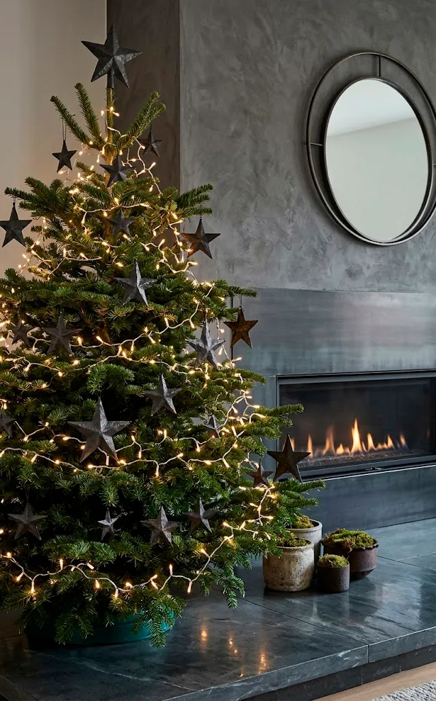 Rustic Christmas tree with hand-forged iron star ornaments.